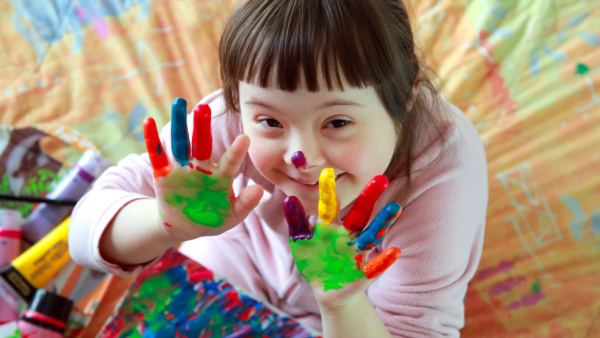 Cute little girl with painted hands