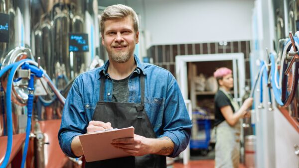 Young bearded man smiling at the camera