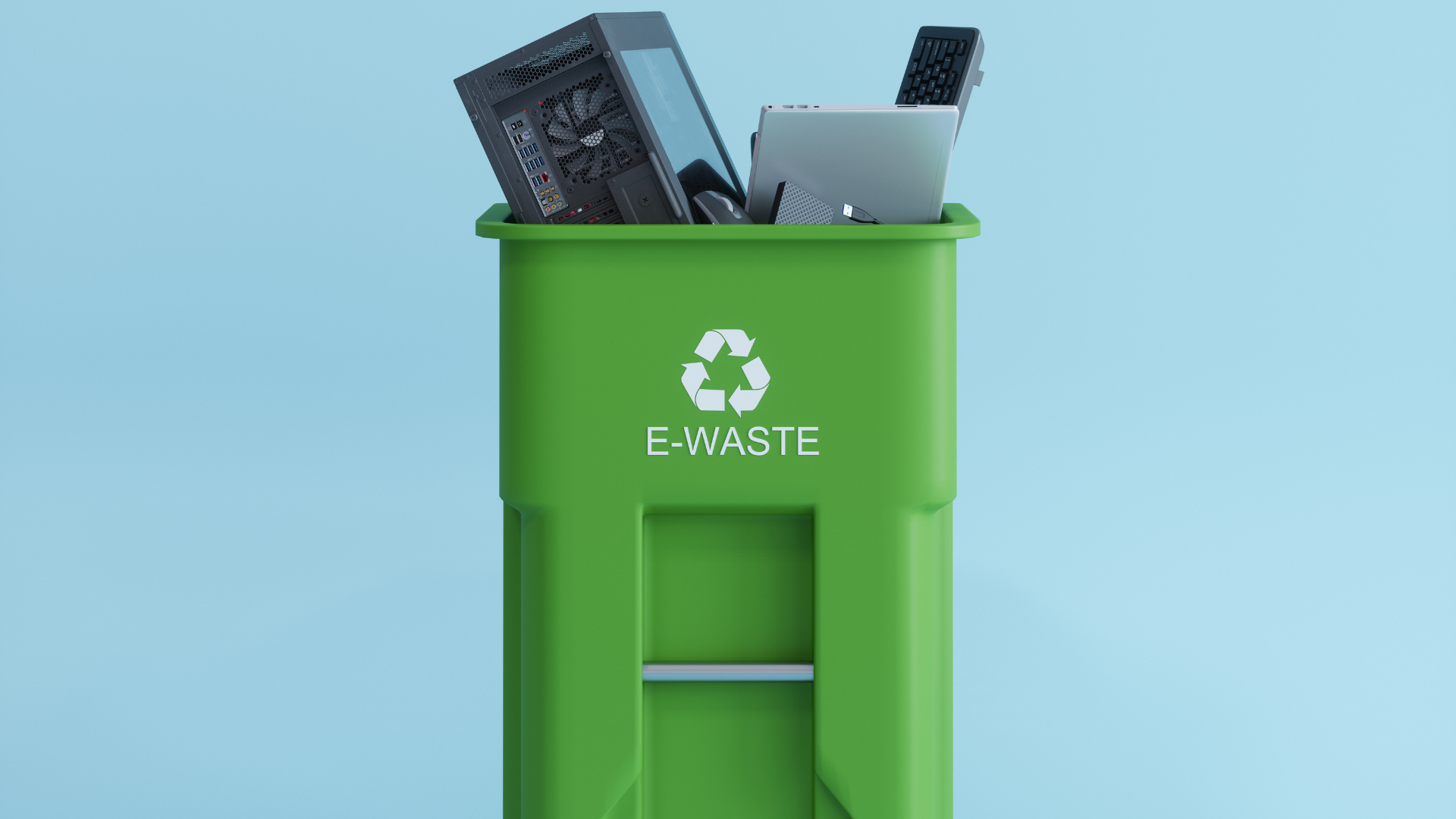 Electronic wastes collected in a green colored garbage bin with e-waste symbol