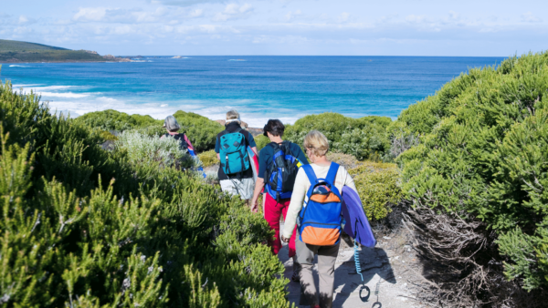 Visitors hiking to the beach