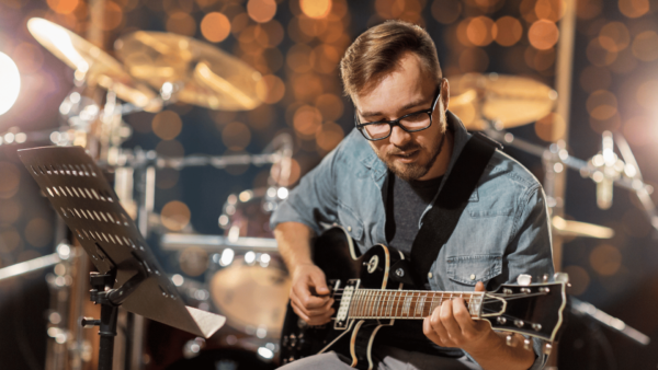Live musician on stage with guitar instrument