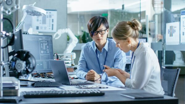 Researcher with consultant working at a university office laboratory