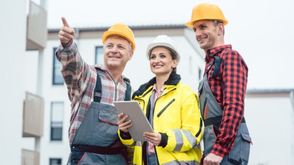 Builders inspecting construction sites