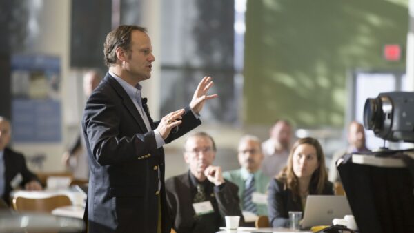 Man participating in conference