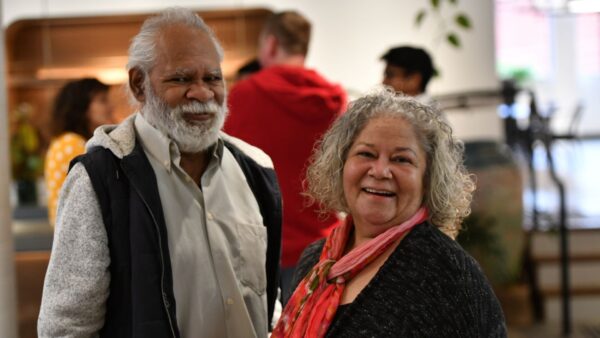 Happy man and woman standing in the room