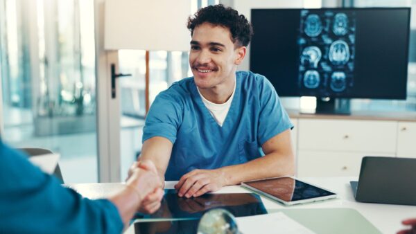 Handshake, healthcare and doctor with patient for xray consultation with neurology appointment