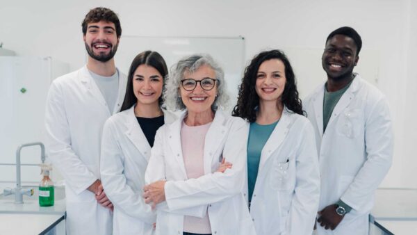 Diverse team of researchers smiling in laboratory