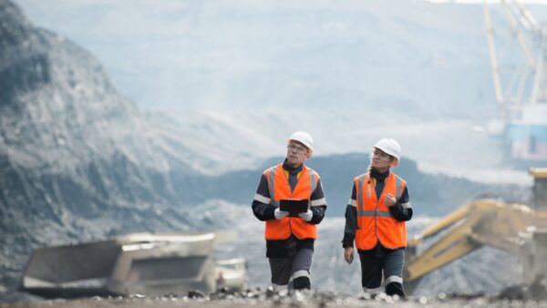 Workers with coal at open pit